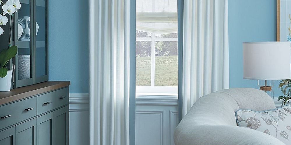 Blue and white drapes inside Newport Beach home