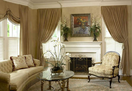 Full-length drapery panels with a swagged top treatment in a formal living room