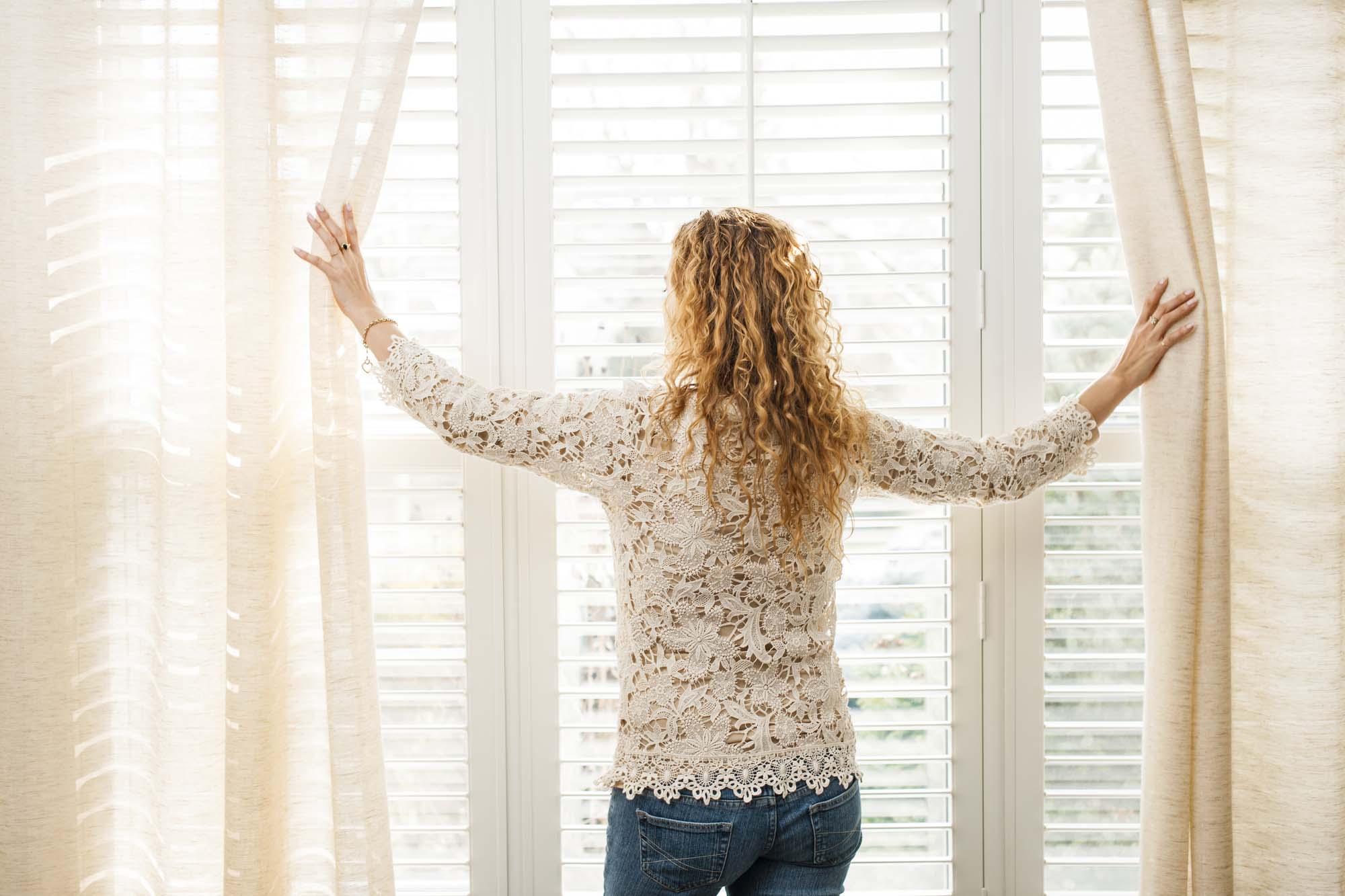 Luminette privacy sheers drawn across a large window